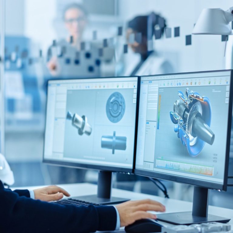 "Ein Bild zeigt einen Entwickler der Fischer Product Consulting GmbH, der ein neues Produkt ganzheitlich am CAD (Computer Aided Design) konstruiert. Der Entwickler arbeitet konzentriert an einem Computer, während er verschiedene Aspekte wie Design, Funktionalität und Innovation in die Konstruktion des neuen Produkts integriert."